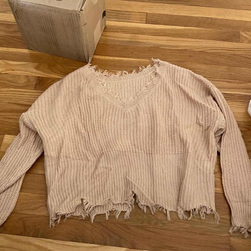 Size small sweater with little rips at the cutoffs